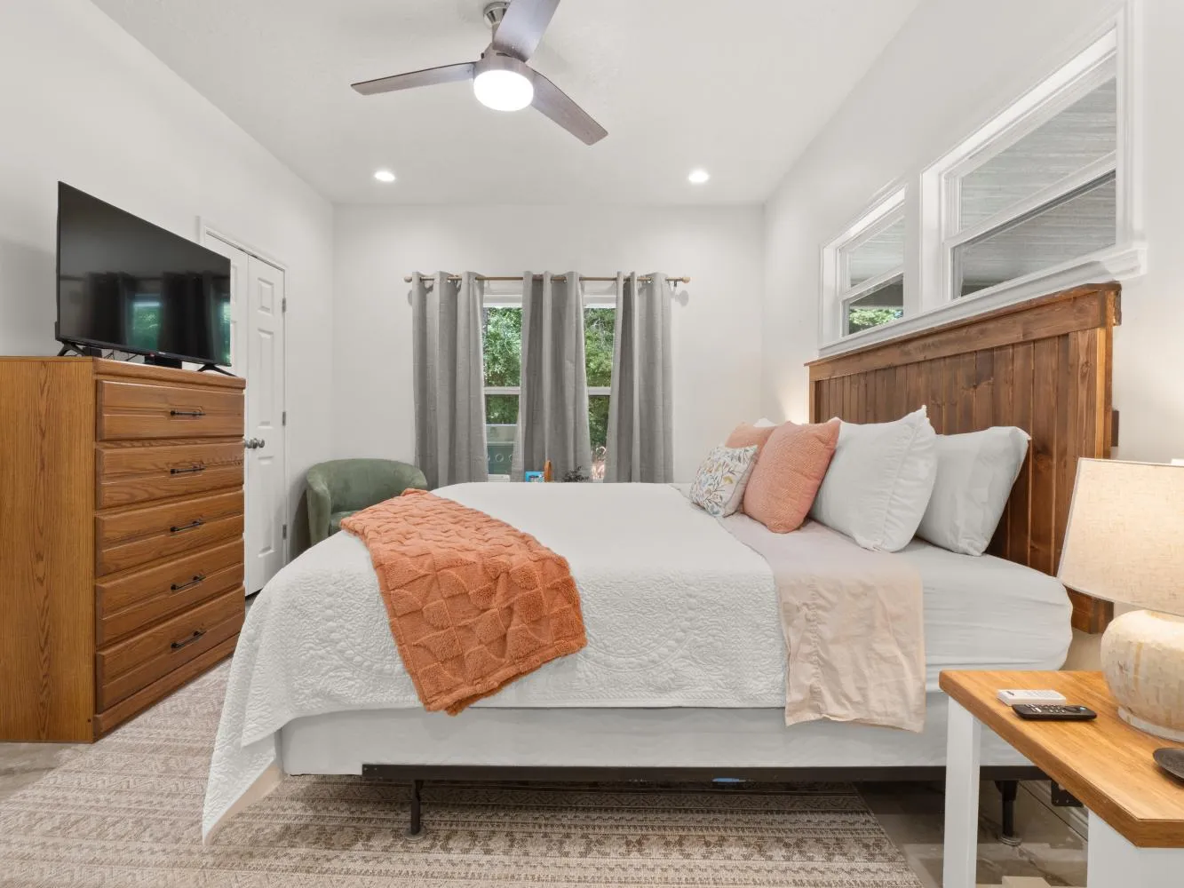 The master bedroom has a king size bed.