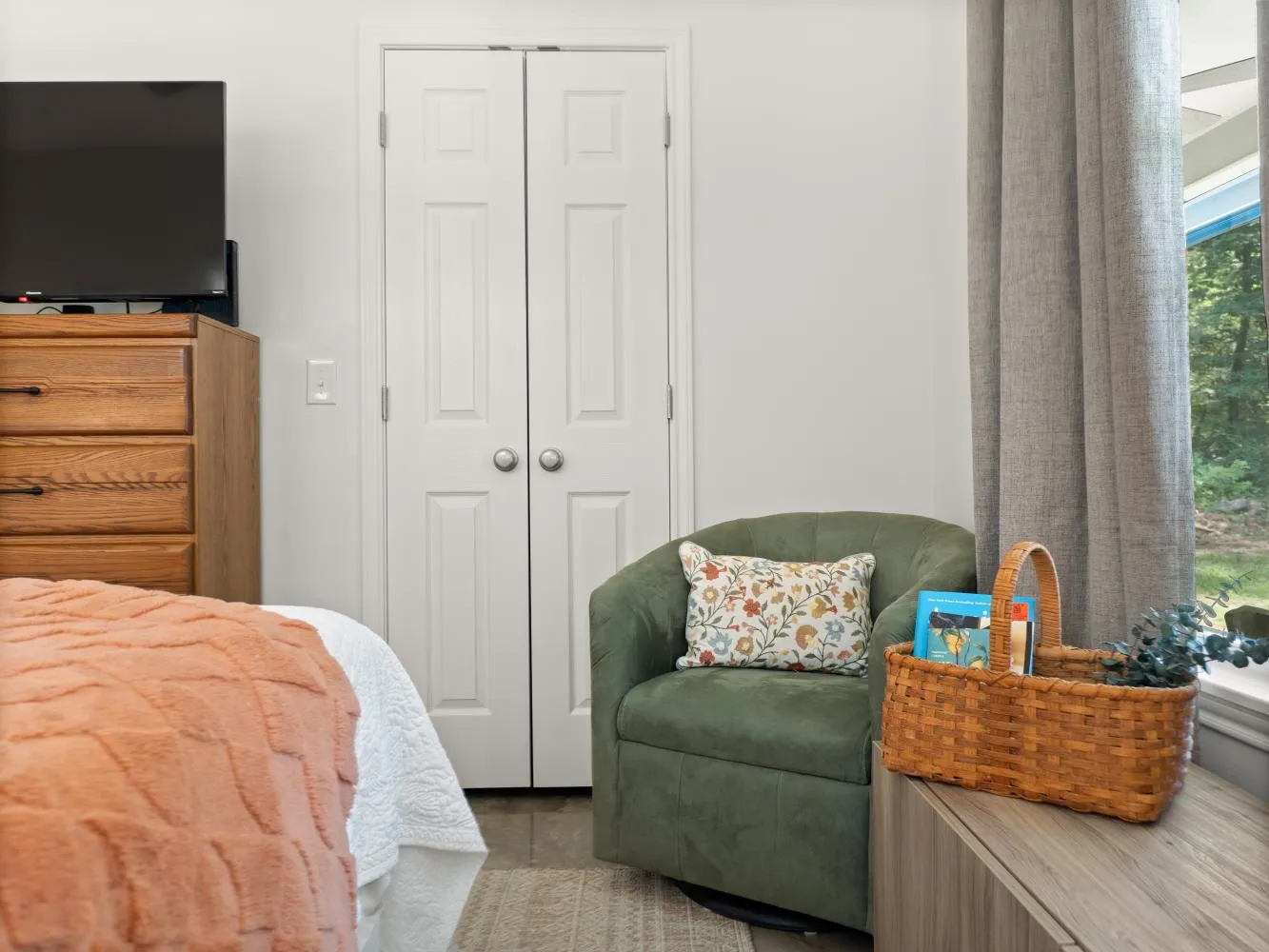 The master bedroom has  a small closet in the corner.