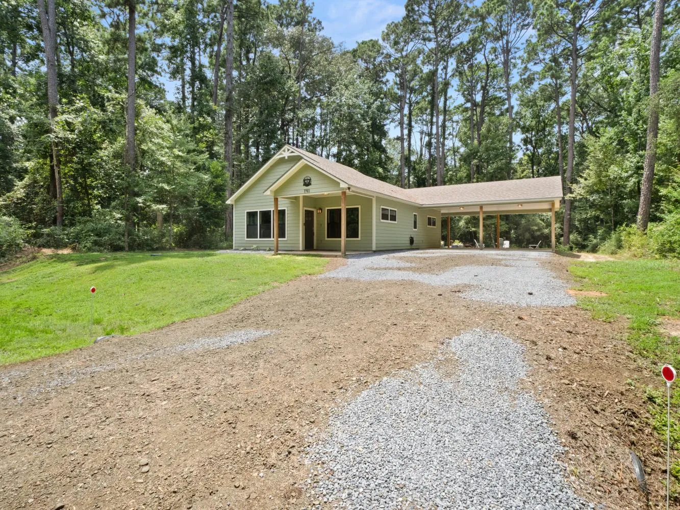 Plenty of parking in the driveway and carport.
