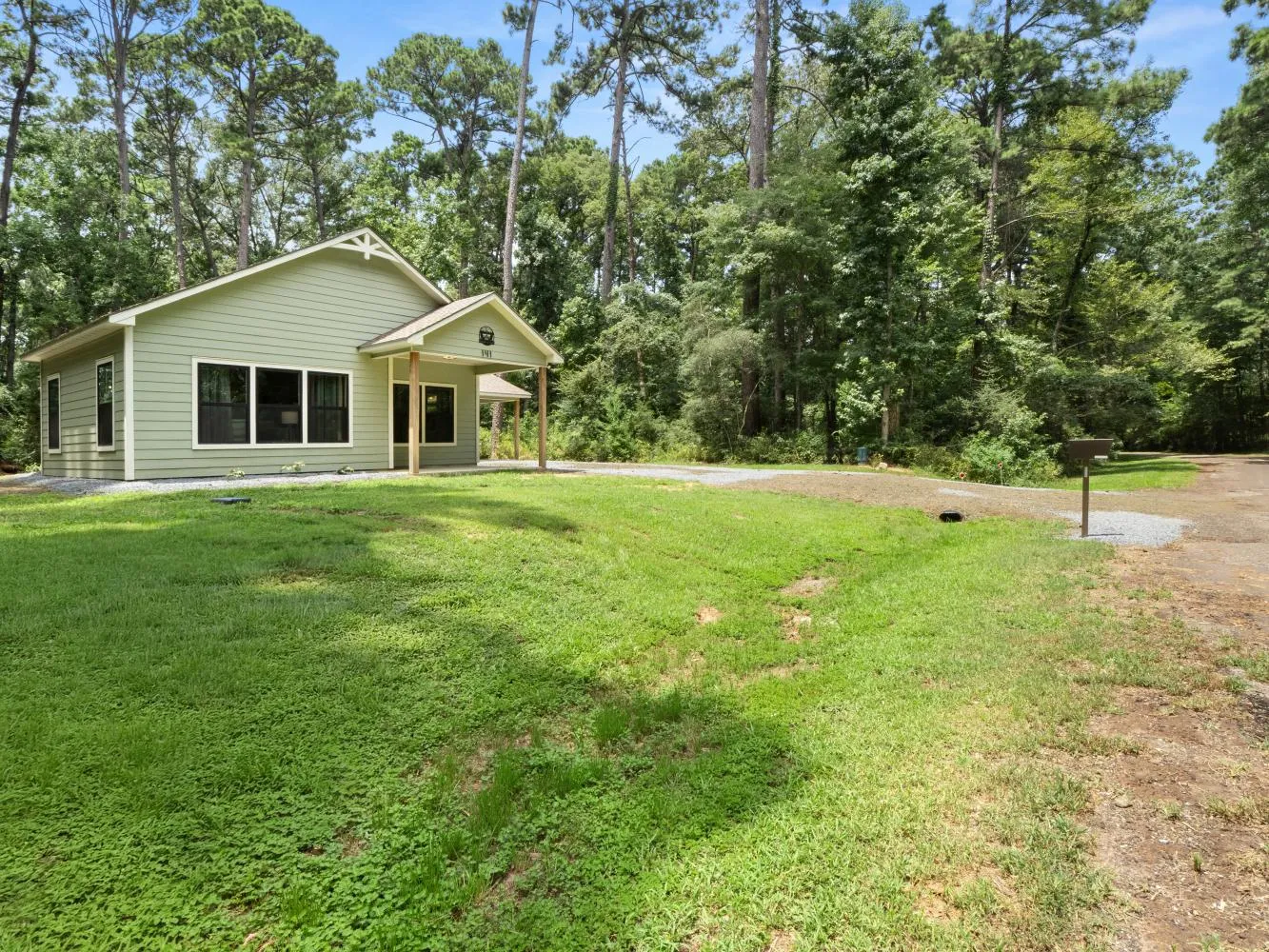 View of Peaceful Pine Bungalow as you drive up on Ensign Drive.